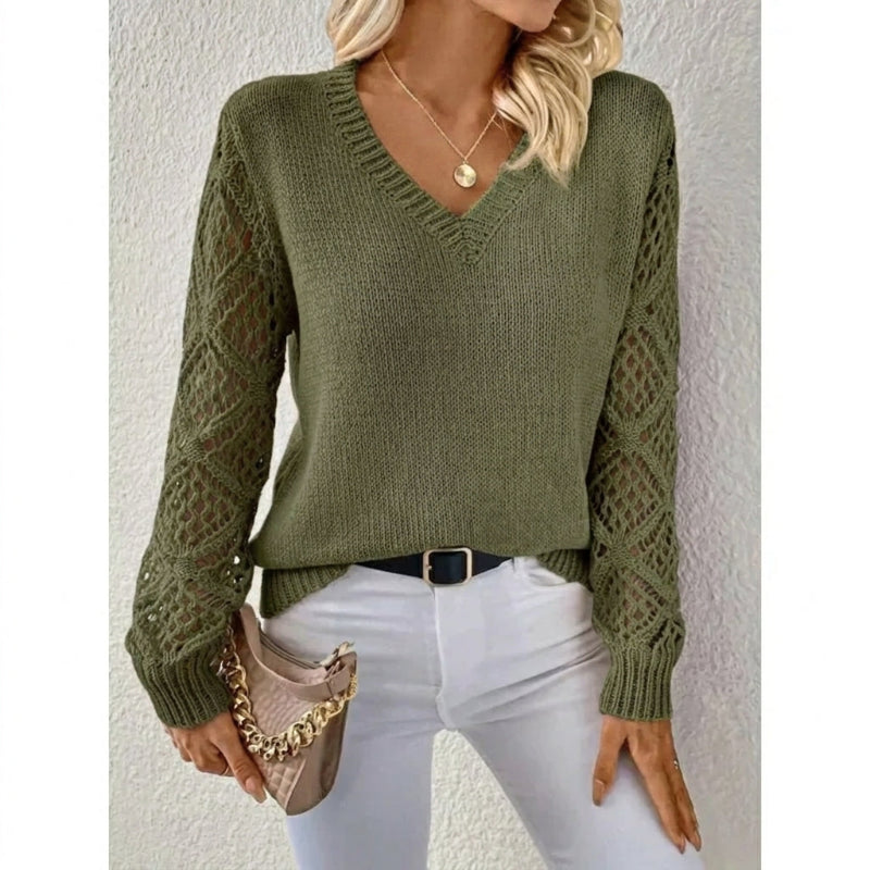 Fashionable women's V-neck knit sweater with elegant open sleeves, a cozy and stylish choice for winter.