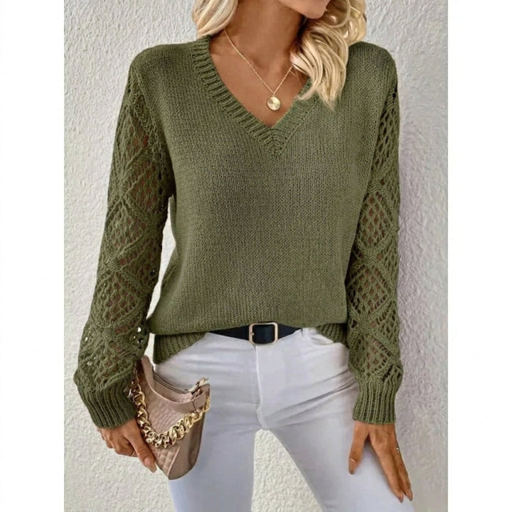 Fashionable women's V-neck knit sweater with elegant open sleeves, a cozy and stylish choice for winter.