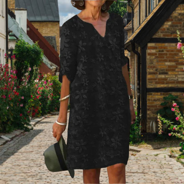 Comfortable women's half-sleeve floral print dress with a flattering v-neck, ideal for spring & summer fashion.