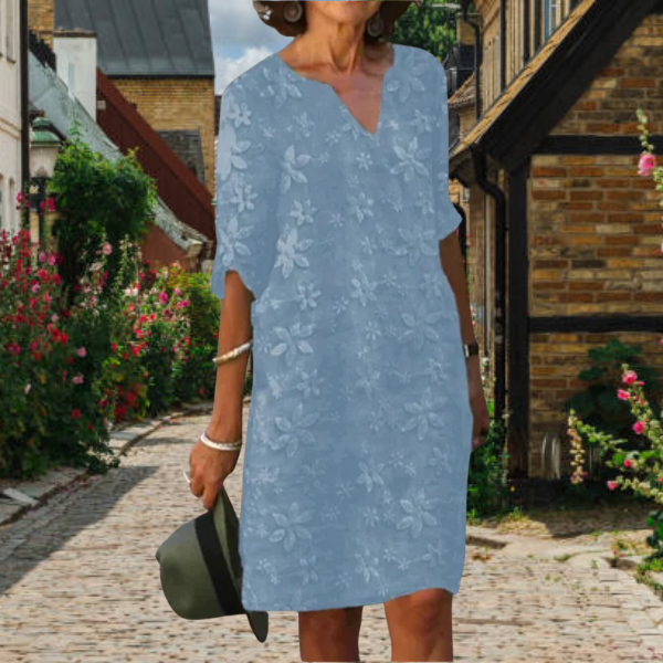 Flattering floral print women's dress with v-neck and half sleeves. A comfortable, modern versatile outfit.