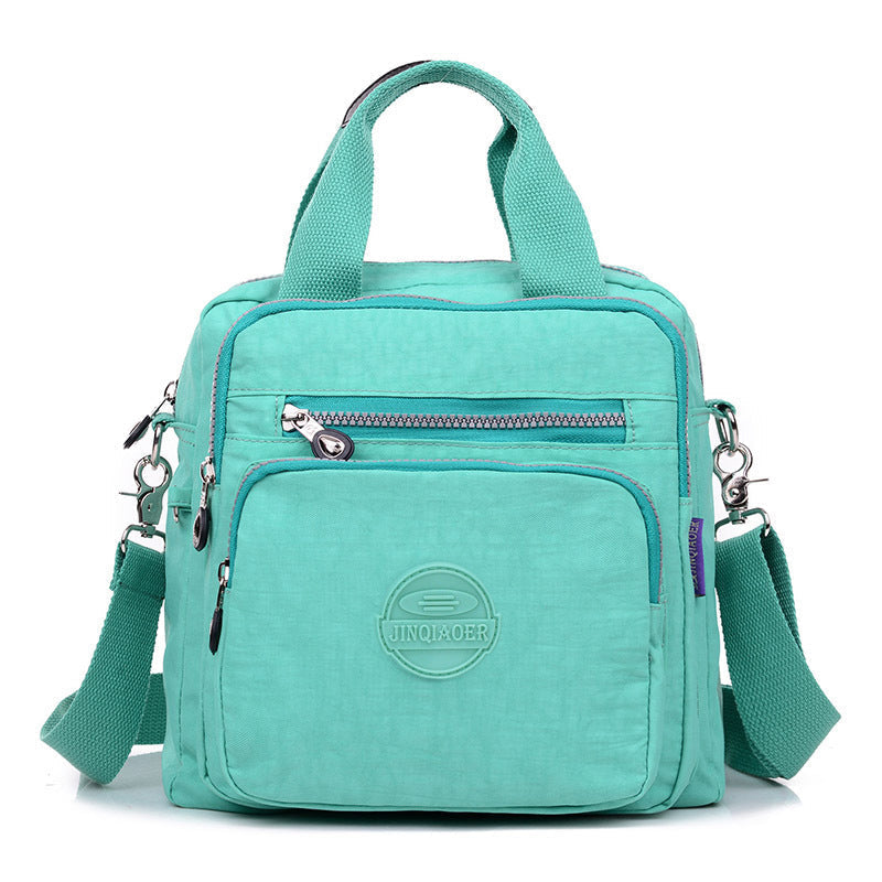 Secure multi-pocket women's water-resistant crossbody bag, ideal for keeping valuables safe during travel.