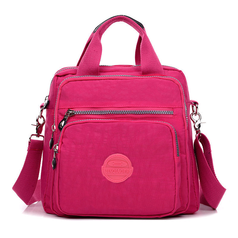 Sleek water-resistant women's crossbody bag, versatile design with ample space for essentials.