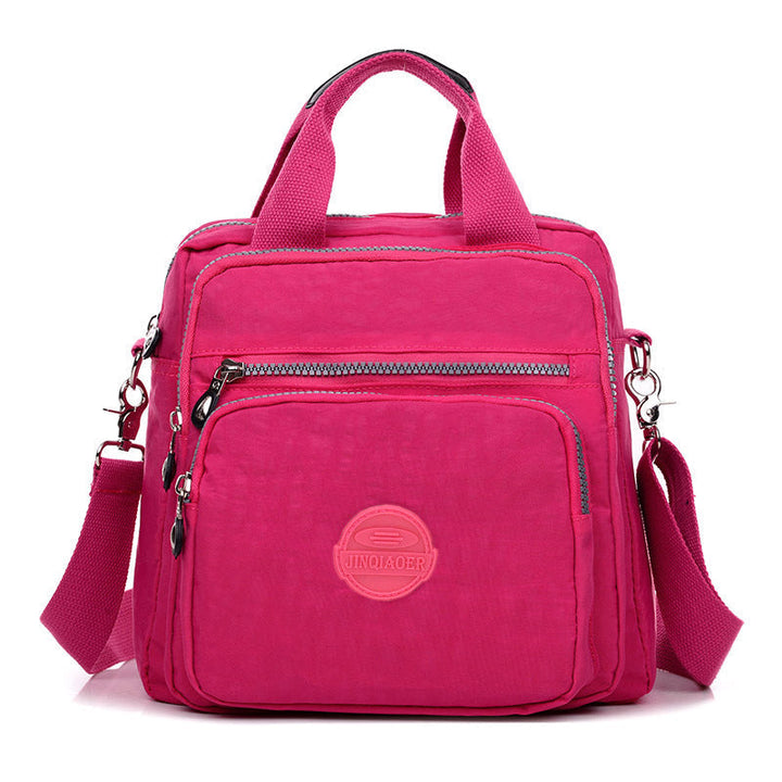 Sleek water-resistant women's crossbody bag, versatile design with ample space for essentials.