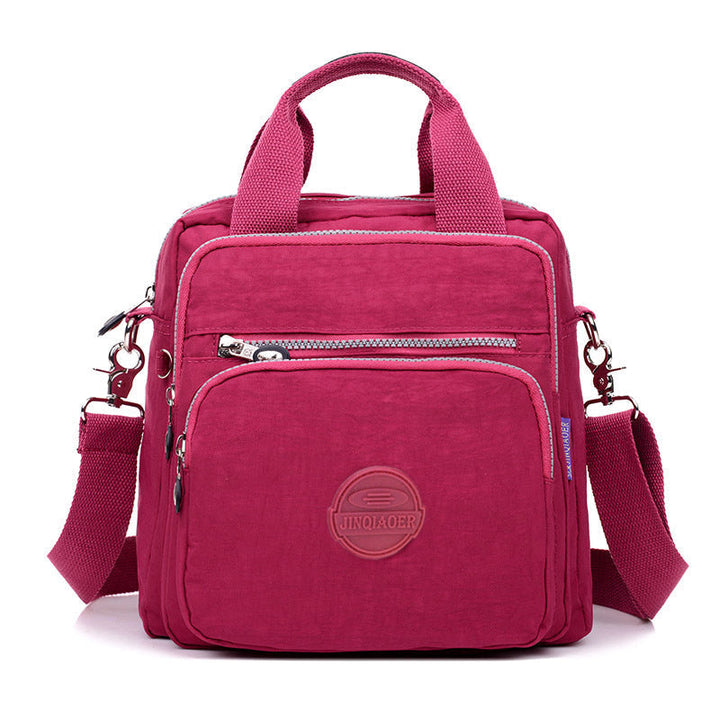 Compact water-resistant travel accessory: women's crossbody bag with secure pockets for safe journeys.