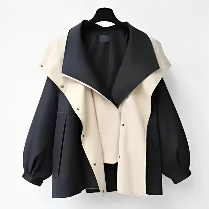 Close-up of the waterproof fabric on women's stylish rain jacket. Durable, lightweight material for all-weather fashion.