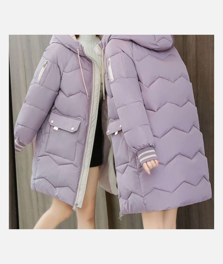 Woman wearing a warm winter coat, stylish and cozy for outdoor activities or city wear.