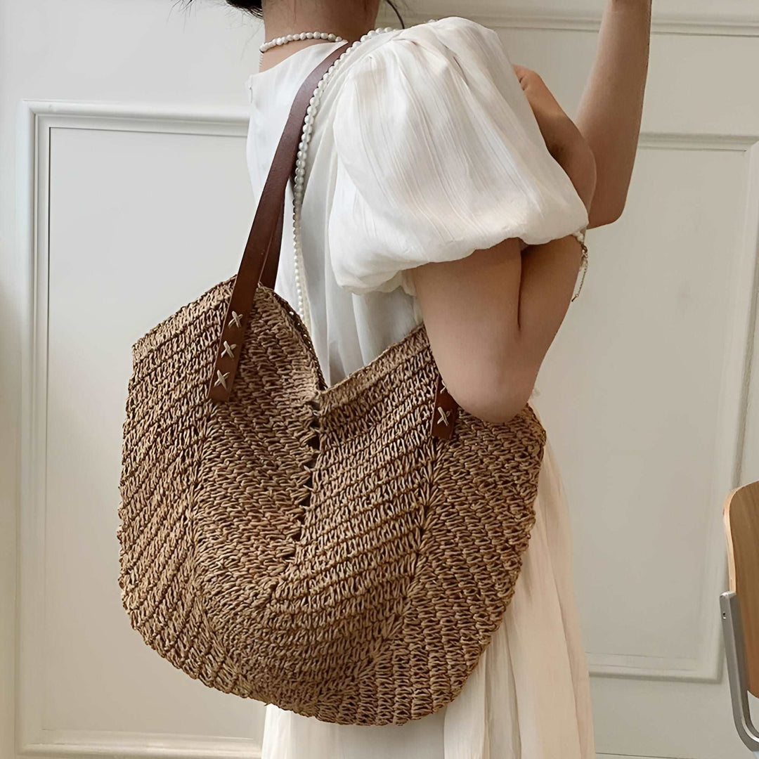 Stylish women's woven beach bag, a perfect summer shoulder tote for vacation essentials.