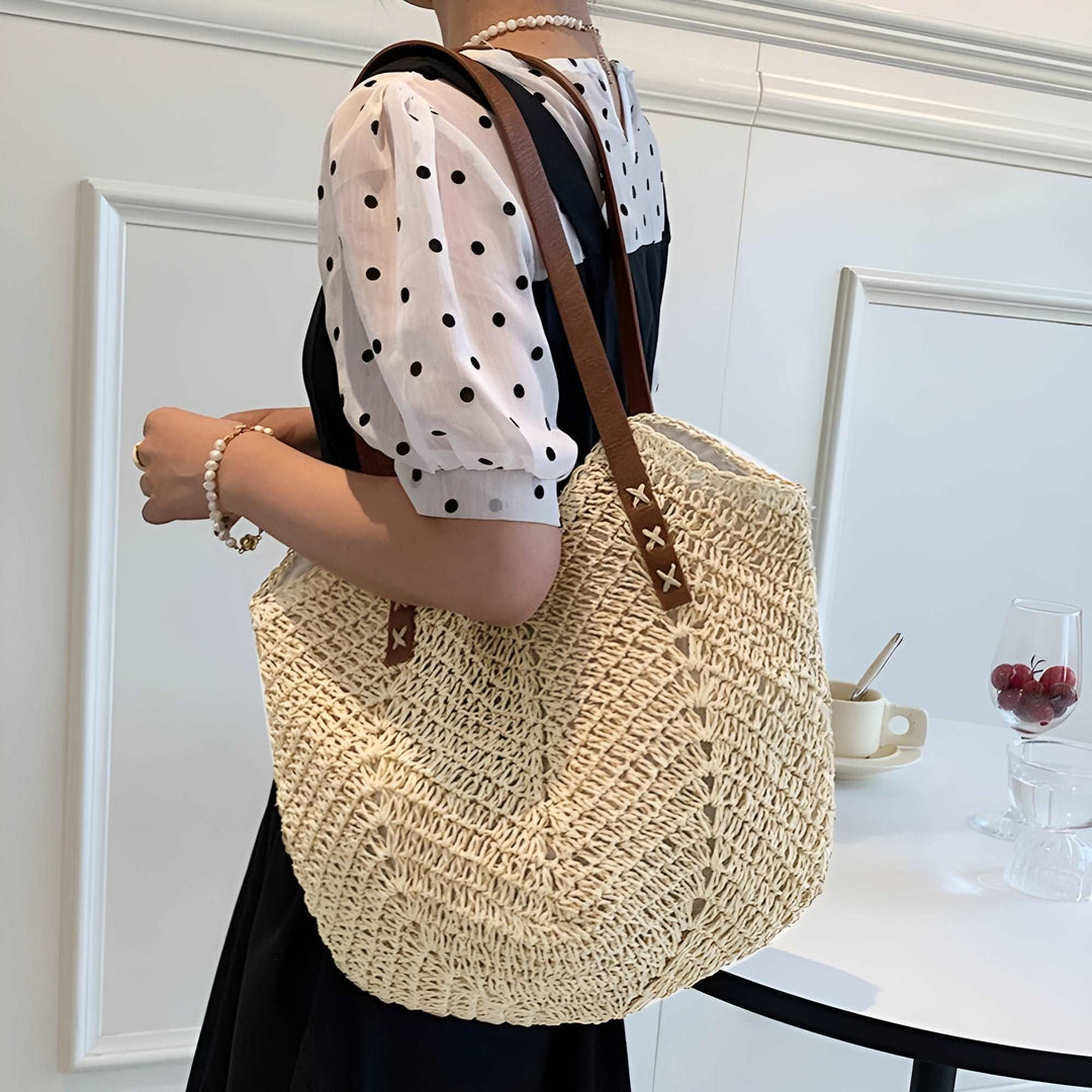 Fashionable woven shoulder tote, ideal women's summer bag for beach days or casual vacation outings.