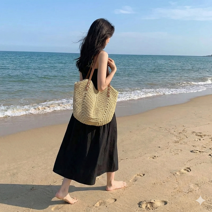 Chic women's woven beach bag with ample space, a versatile shoulder tote for stylish summer adventures.