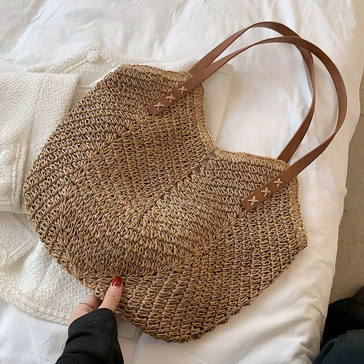 Spacious woven beach tote for women, a durable and stylish shoulder bag perfect for all your summer needs.