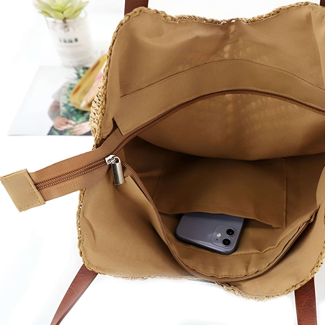 Elegant natural woven beach bag, a comfortable women's shoulder tote, perfect for a casual summer day out.