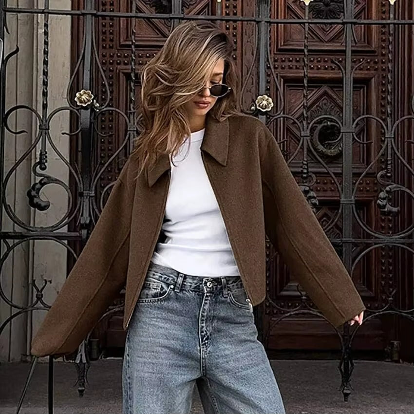 Women's zip-up outerwear with a stylish collar, ideal for casual layering in fall and winter.