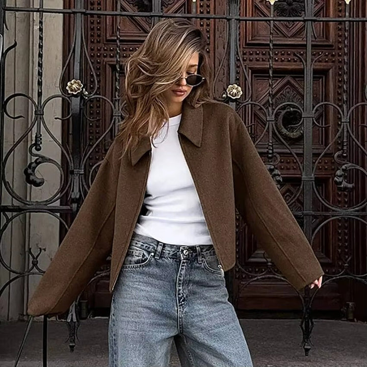 Women's zip-up outerwear with a stylish collar, ideal for casual layering in fall and winter.