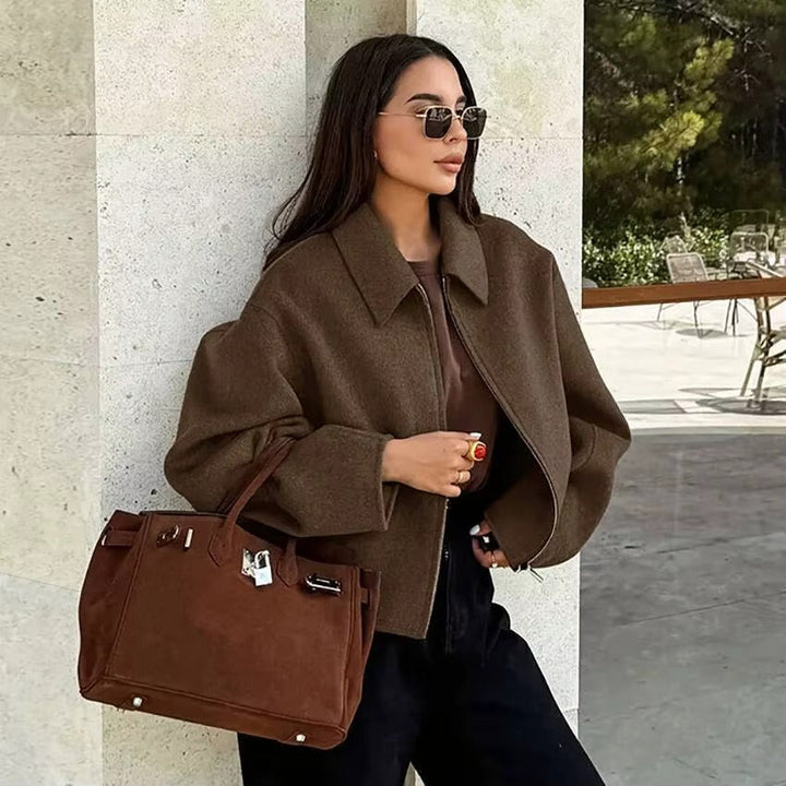 Comfortable women's zip-up collar jacket for easy layering; a chic everyday outerwear choice.