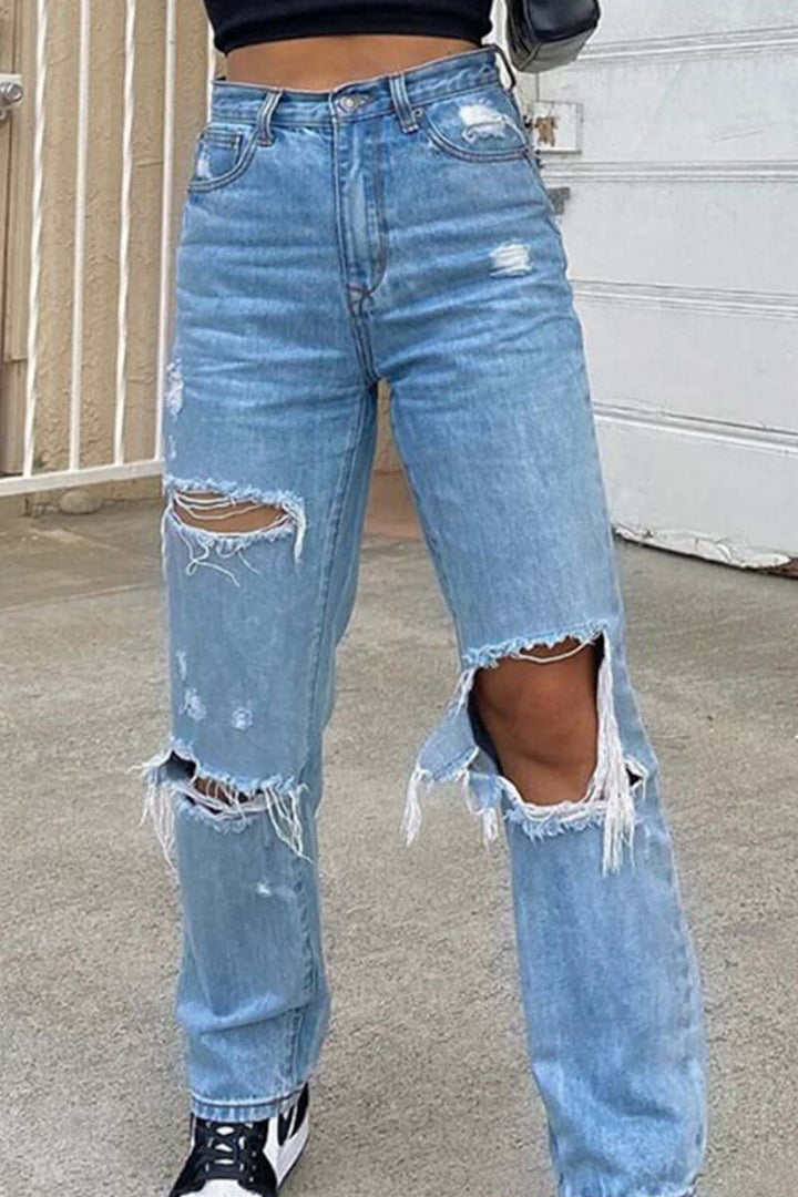 Flattering slim fit women's high waist ripped jeans with distressed denim, comfortable & stylish.