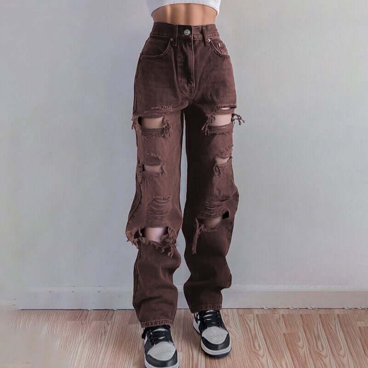 Distressed women's casual jeans with a relaxed fit, featuring trendy rips and a raw hem.