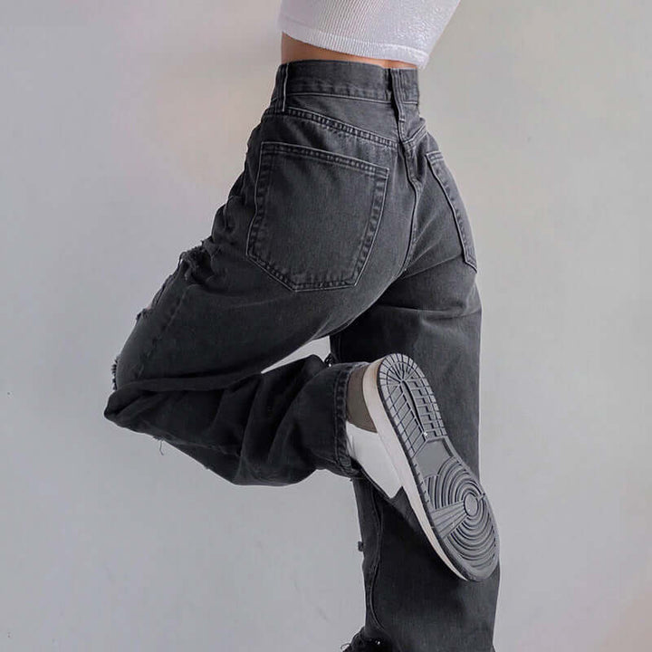 Effortless women's fashion jeans with stylish rips, a raw hem, and comfortable distressed denim.
