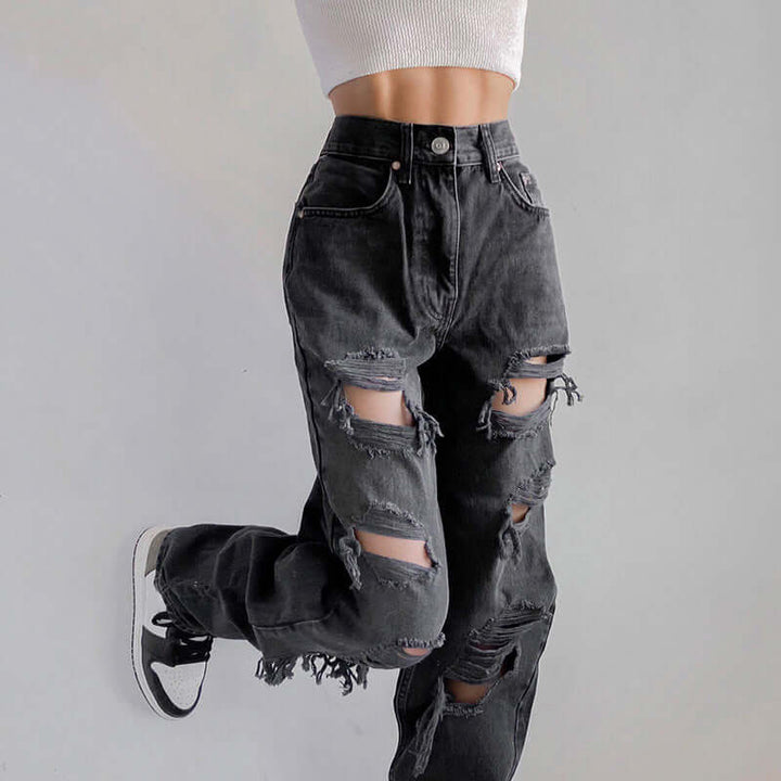 Women's trendy ripped jeans featuring a stylish raw hem, perfect for casual everyday fashion.