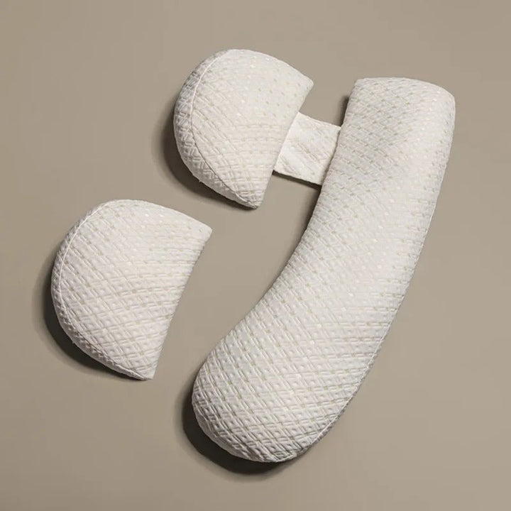 U-Shaped maternity pillow in white, offers full-body support for head, neck, back, belly, and legs with hypoallergenic fabric