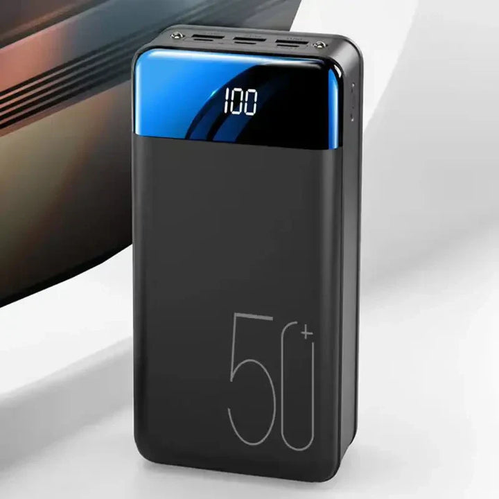 Ultra capacity 50K mAh power bank with versatile use, shown in sleek design and compact size for portable charging needs.