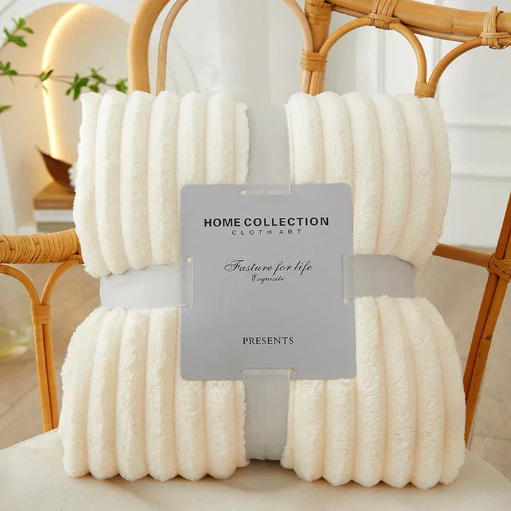 Modern wide striped fleece blanket, versatile for living room or bedroom.