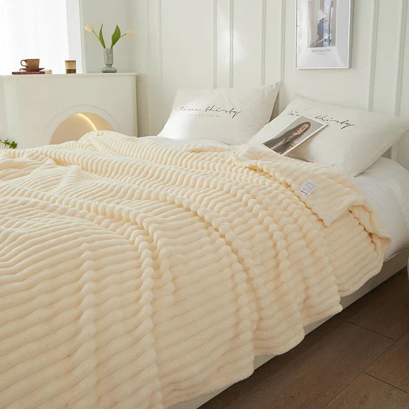 Elevate your home decor with this elegant wide striped fleece blanket.