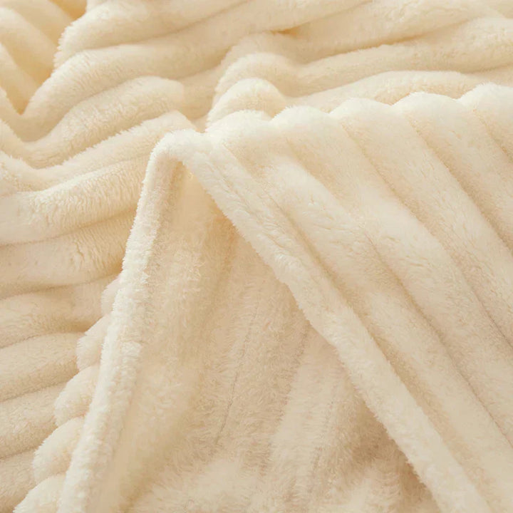 A cozy wide striped flannel blanket, perfect for a warm and inviting space.