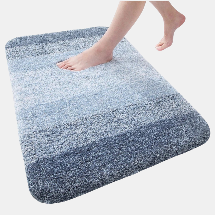 Dry feet, safe floor with UltraAbsorb non-slip bathroom mat. Soft, absorbent microfiber bath rug offers comfort & safety.