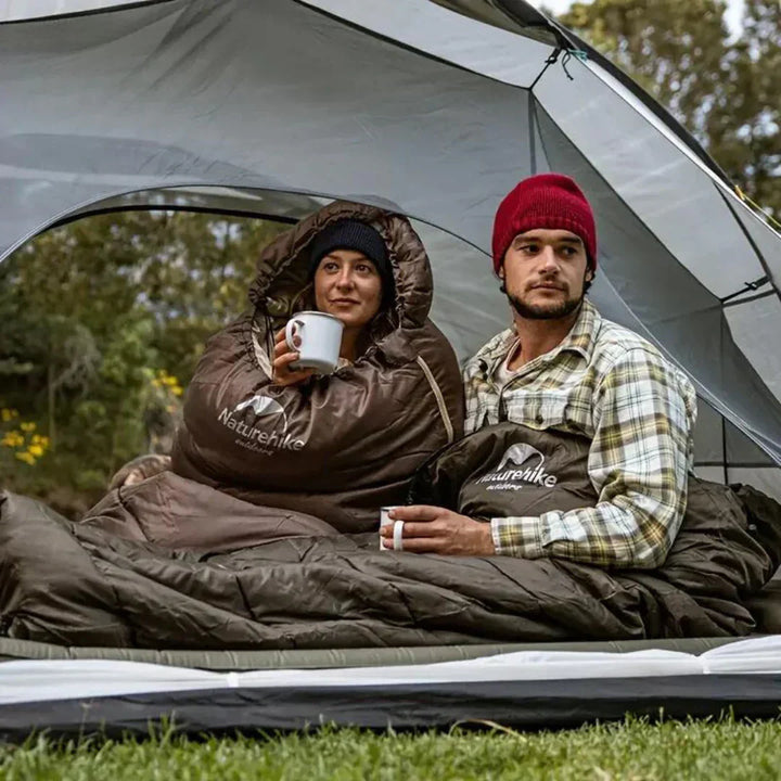 Ultralight women's insulated camping sleeping bag; lightweight, compact, blue fabric ideal for cold-weather adventures.