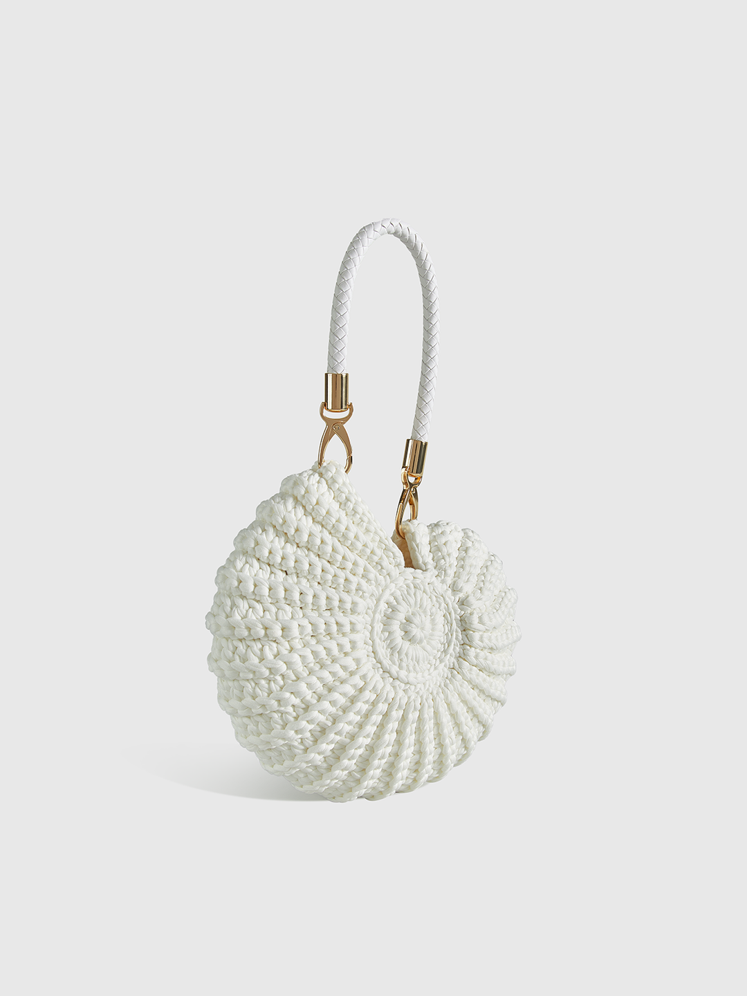 Women's artistic conch-shaped crocheted handbag, a unique fashion statement accessory in elegant polyester.