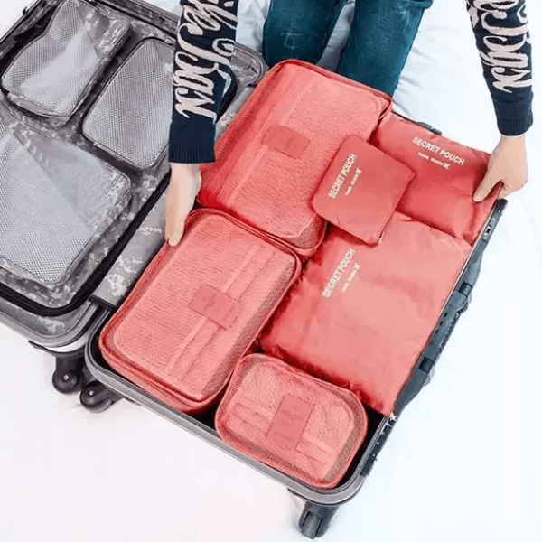 Unisex 12-piece travel packing cubes set for organized luggage. Space-saving storage bags for clothes.