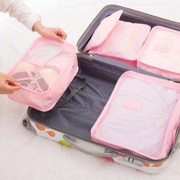 Space-saving travel packing cubes set (12 pcs) for easy organization of clothes & accessories.