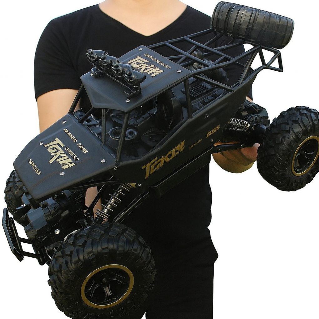 High-speed 4x4 remote control monster truck racing through an outdoor muddy trail. Rechargeable RC toy vehicle for fun.