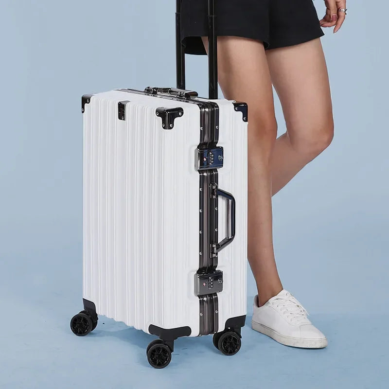 Close-up of the secure aluminum frame & hardshell texture of a travel suitcase.
