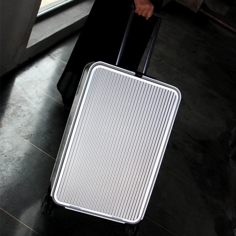 Premium silver aluminum hard-shell checked luggage, stylish & durable for secure international travel.