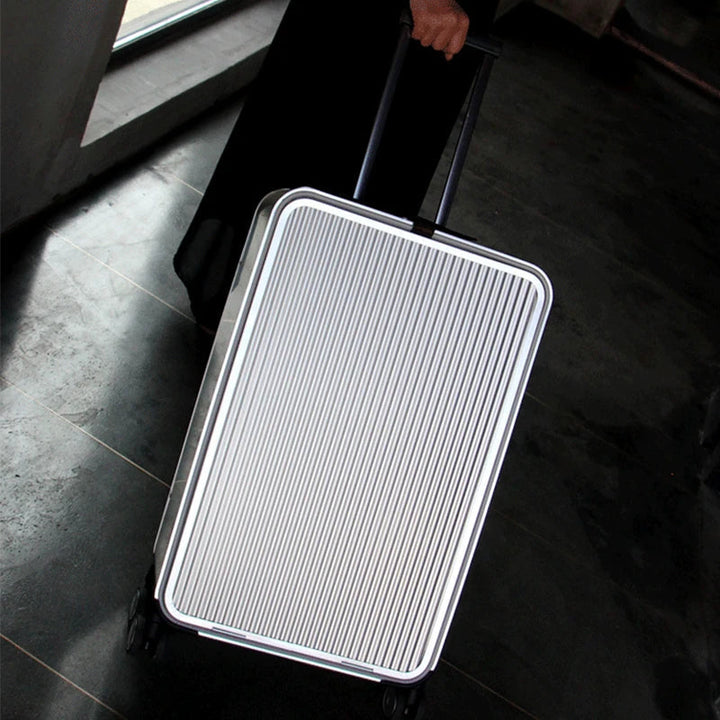 Premium silver aluminum hard-shell checked luggage, stylish & durable for secure international travel.