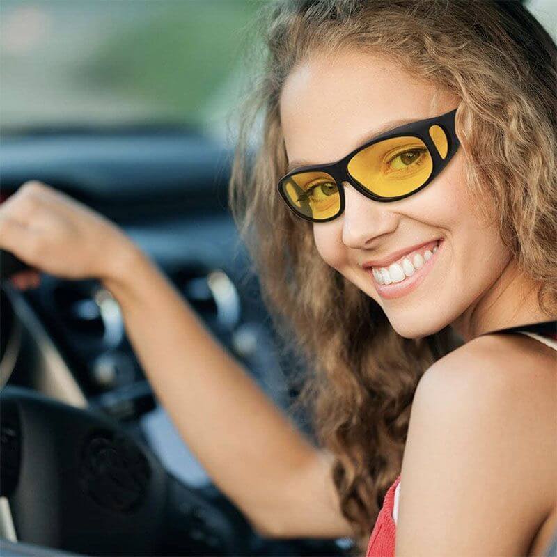 Close-up of polarized anti-glare lenses on unisex driving glasses, improving day & night visibility.