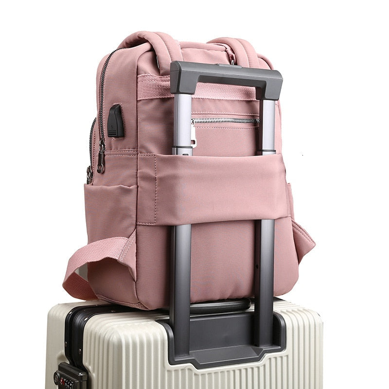 Unisex anti-theft USB charging backpack for daily use. Water-resistant travel bag with laptop compartment.