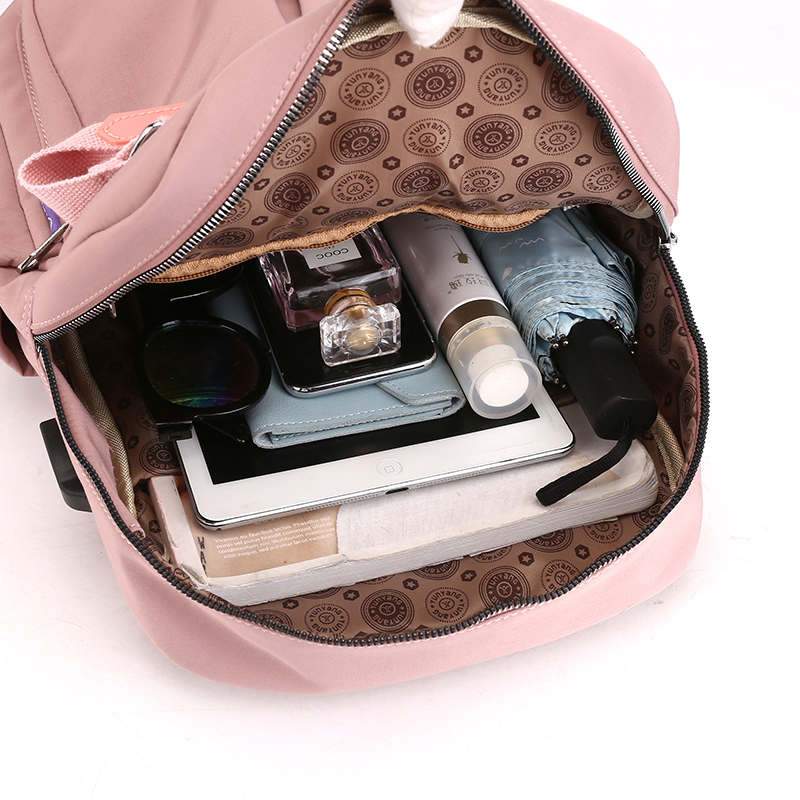 Spacious multi-compartment anti-theft travel backpack. USB charging port for on-the-go power.