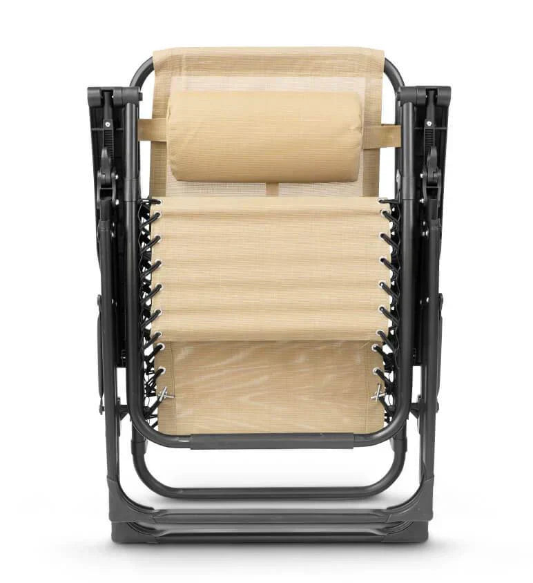 Cream zero gravity relaxation chair with adjustable headrest for ultimate outdoor comfort.