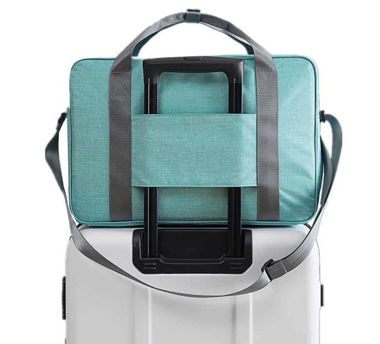 Unisex carry-on suitcase bag with trolley sleeve for easy airport travel. Compact & convenient hand luggage for overnight trips.