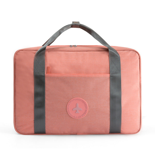 Unisex carry-on travel bag with trolley sleeve, perfect for weekender & overnight trips. Get 1+1 FREE on this compact luggage.