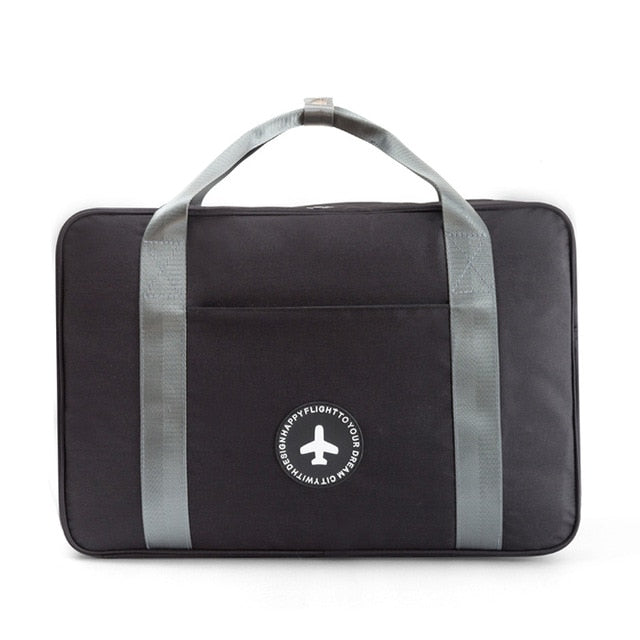 Unisex compact carry-on suitcase bag with trolley sleeve. Easily attaches to larger luggage, perfect for hassle-free airport travel.