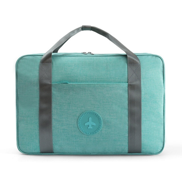 Convenient unisex carry-on bag with a trolley sleeve for seamless airport travel. Ideal compact luggage for overnight & weekender trips.