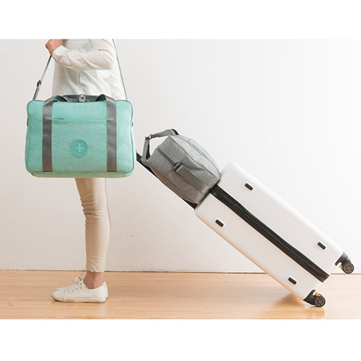 Efficient unisex hand luggage carry-on bag with trolley sleeve. Perfect for compact weekender, overnight travel, & airport convenience.