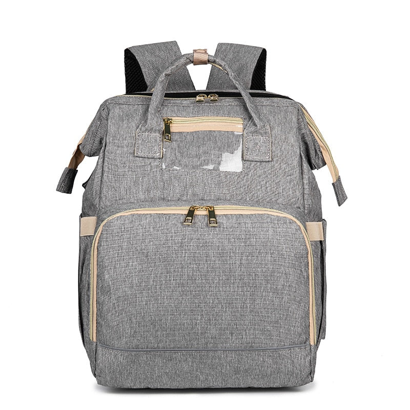 Compact convertible nappy backpack with bassinet, perfect for travel & convenient baby care.