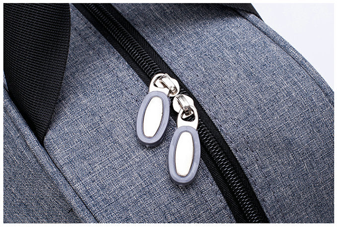Unisex carry-on luggage bag rolling smoothly through an airport terminal, essential travel gear.