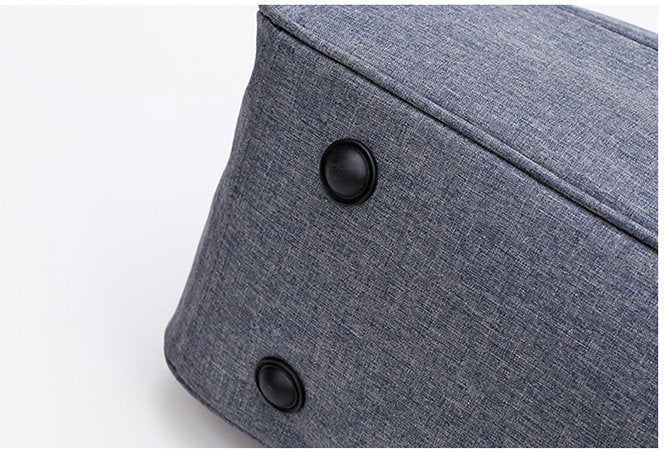 Unisex convertible carry-on bag worn as a backpack, offering hands-free convenience for travel.