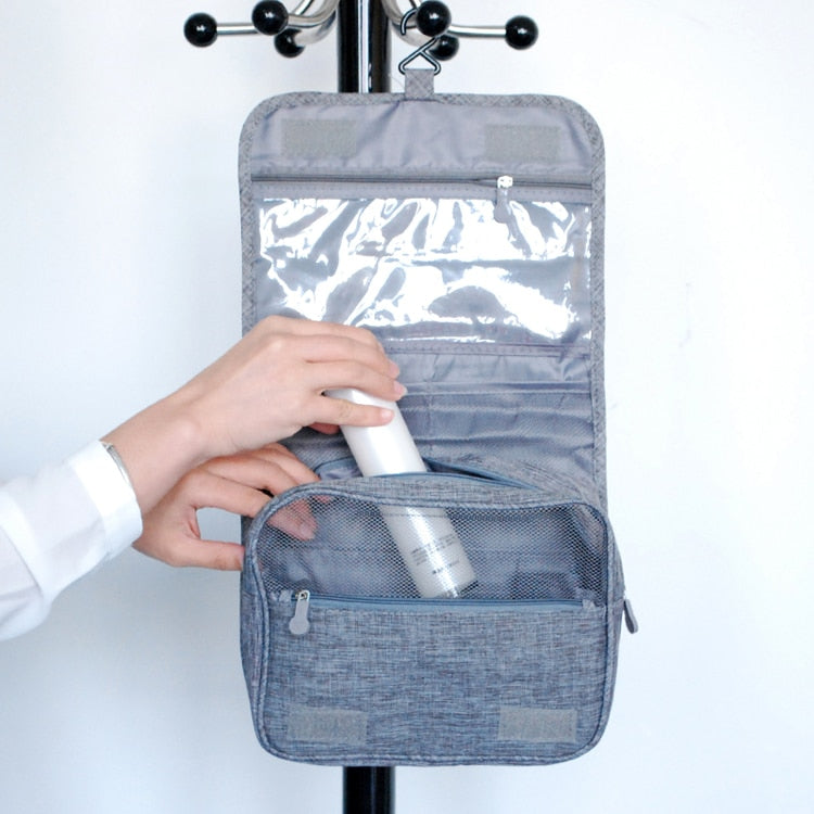 Spacious unisex deluxe hanging toiletry bag. High-capacity travel organizer for all personal items.