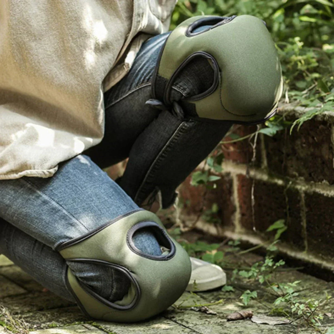 Unisex ergonomic gardening knee pads with thick cushioning on green grass, offering comfort and support for kneeling tasks.